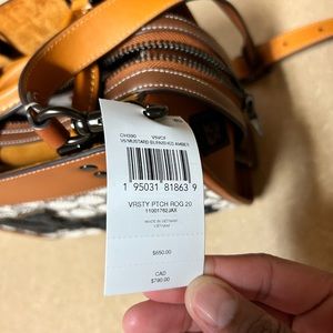 Barely used COACH NY small crossbody Rogue 20 in signature text